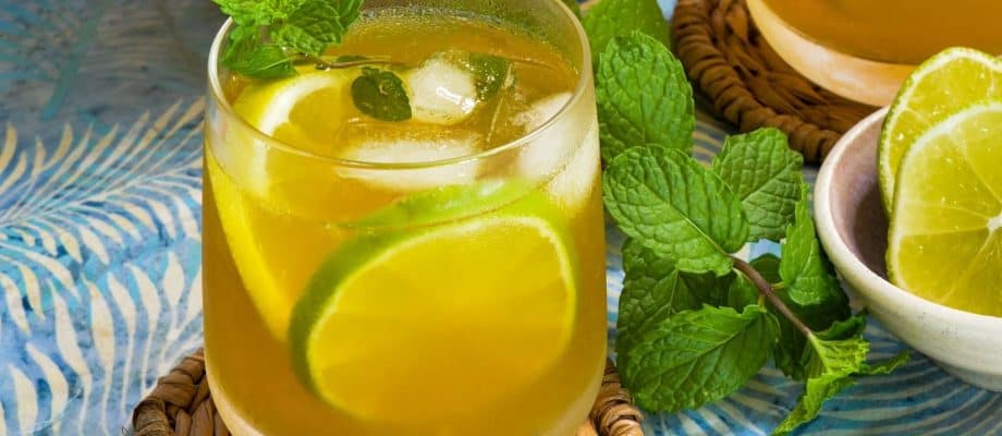 Turmeric-Ginger Lemon Tea in clear glasses with pitcher