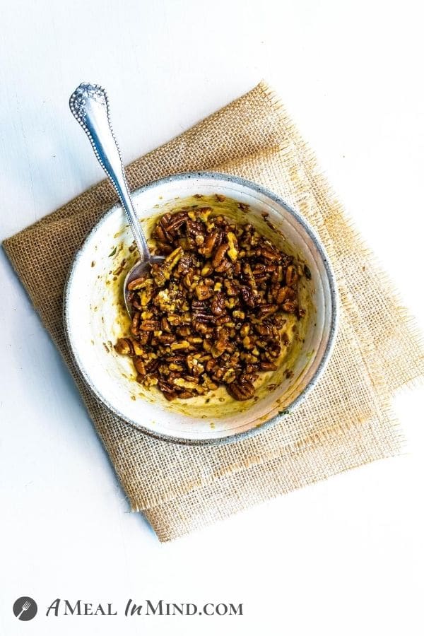 pecans marinating in Balsamic Vinaigrette in bowl