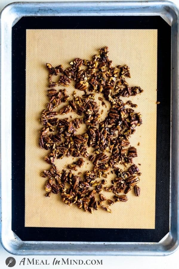 roasting pecans in Balsamic Vinaigrette on baking platter