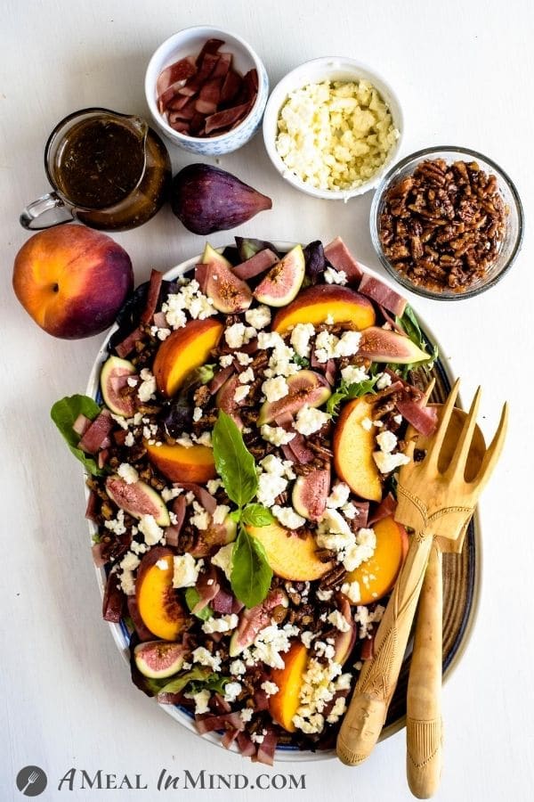 Fig-Peach Pecan Salad with Feta and Balsamic Vinaigrette with toppings in small bowls