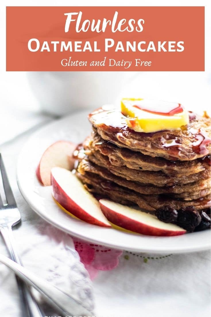 flourless oatmeal pancakes on white plate with fresh fruit