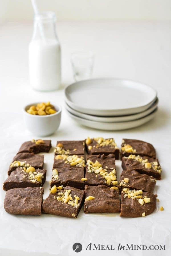 Macadamia Nut"Ella" Brownies 3 Ingredient with brownies cut and on table with small plates