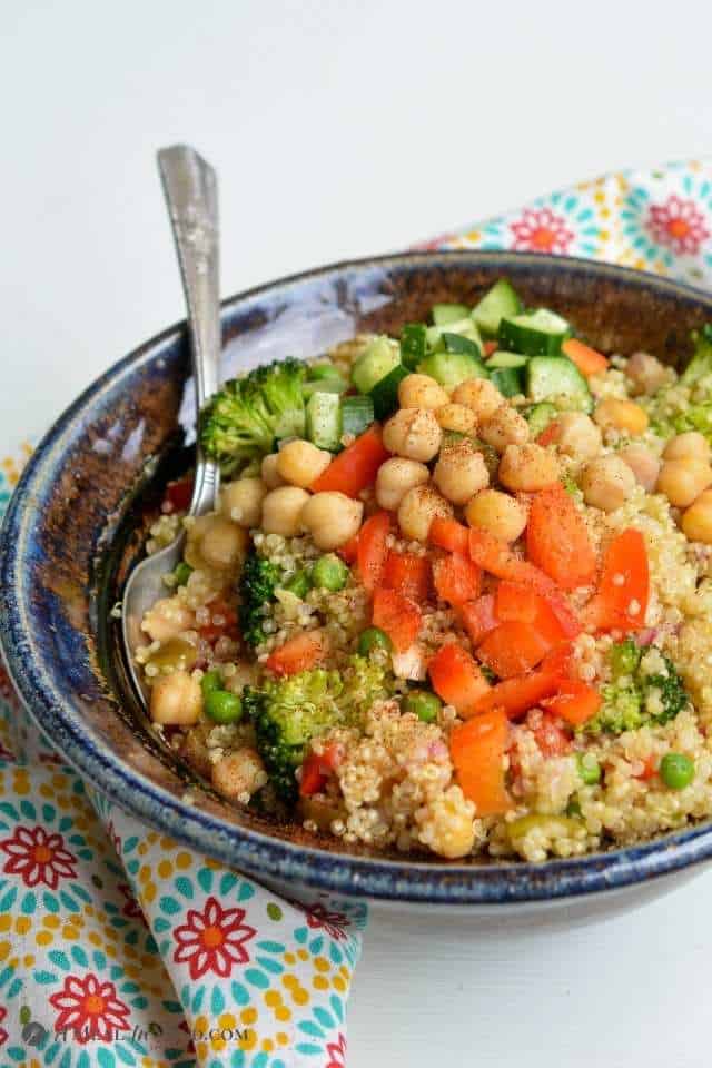 Mexican Quinoa Bowl with Corn and Peppers in ceramic bowl with cumin