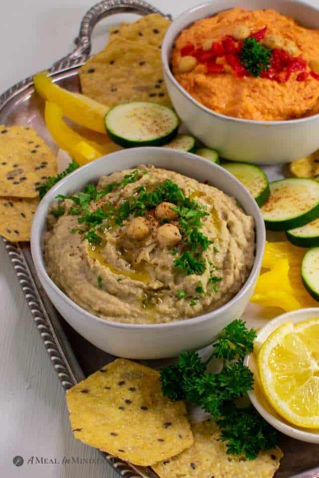 Eggplant and Red Bell Pepper Hummus Platter with eggplant dip in foreground