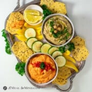 Eggplant and Red Bell Pepper Hummus Platter on silver tray