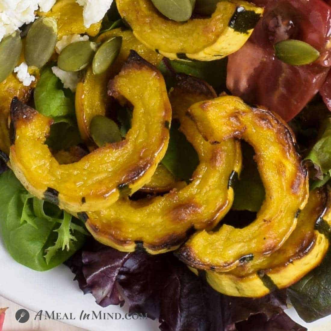 close-up of roasted slices of delicata squash