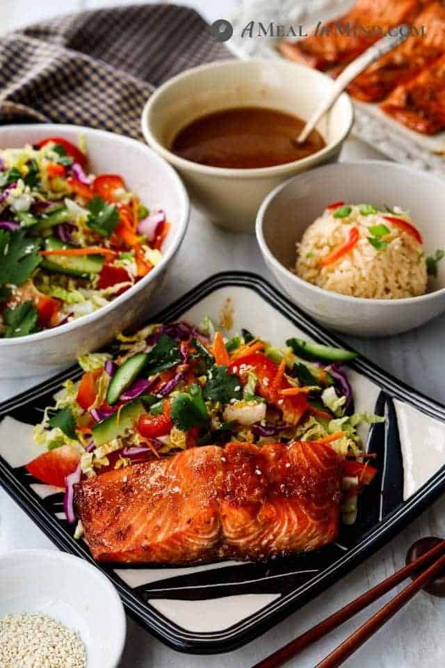 air fryer hoisin salmon with side dishes on plates