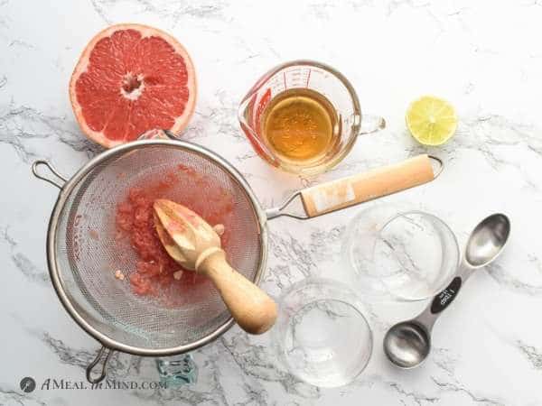 overhead view of ingredients gathered for paloma mocktails