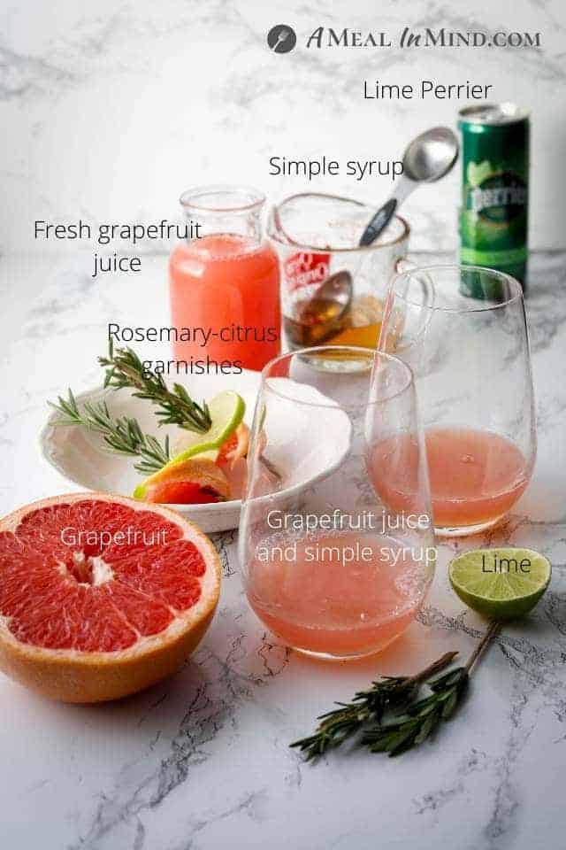 ingredients for rosemary-grapefruit paloma mocktail on marble table