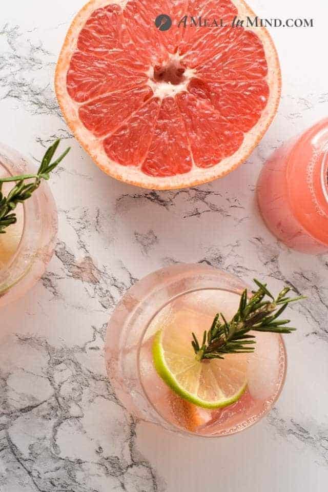 overhead view of paloma mocktails and cut grapefruit