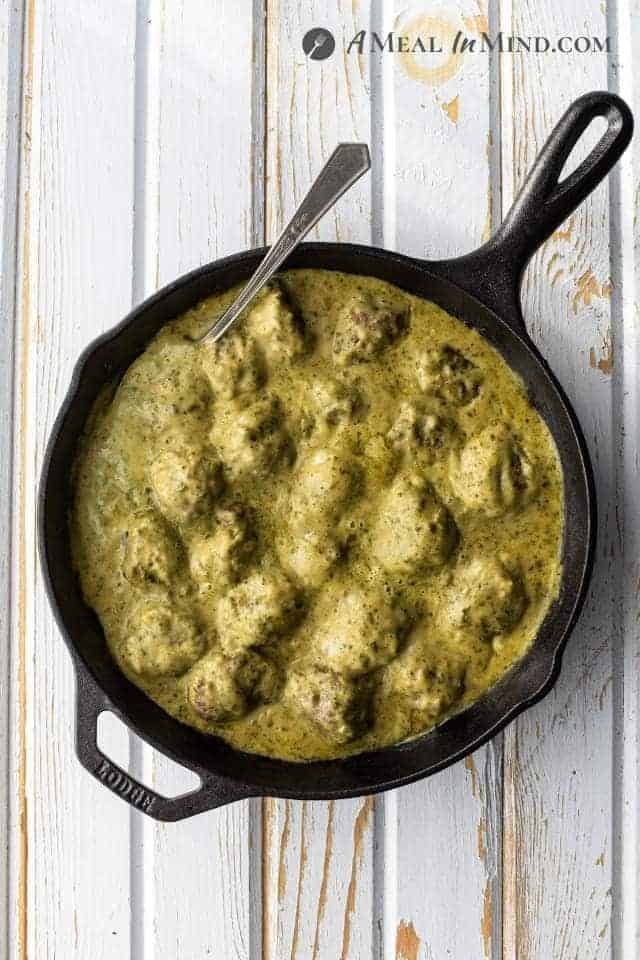 Pesto Meatballs in Alfredo Sauce in skillet