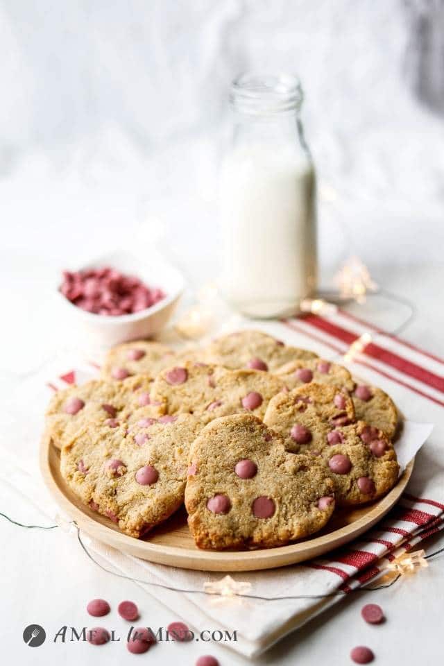 heart shaped cookies with pink chips on a plate