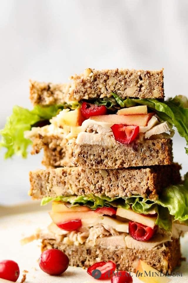 stacked chicken-apple-brie sandwich on Paleo seed bread