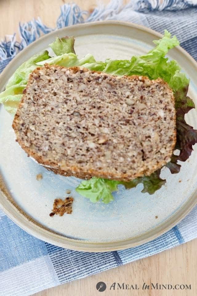 overhead view of chicken-apple-brie sandwich on paleo seed bread