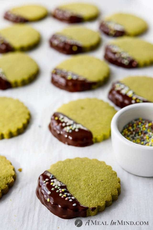 side view of matcha cookies after decorating with chocolate and sprinkles