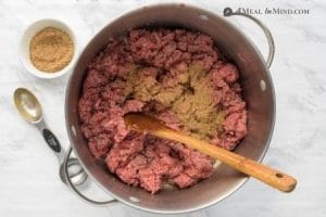 beef and seasonings browning in pan