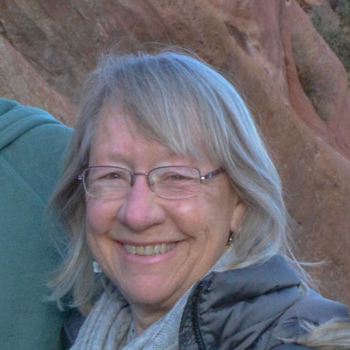 head shot of Beth Allingham with Red Rocks Colorado in background